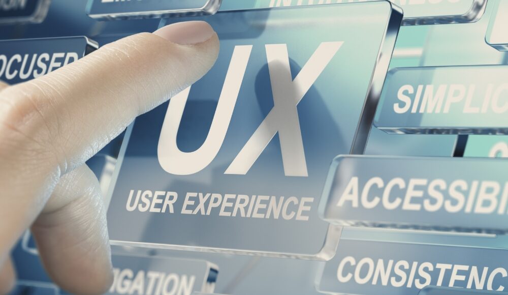 A hand interacts with a transparent digital interface featuring the text "UX USER EXPERIENCE", highlighting the various elements that contribute to an optimal AI user experience.