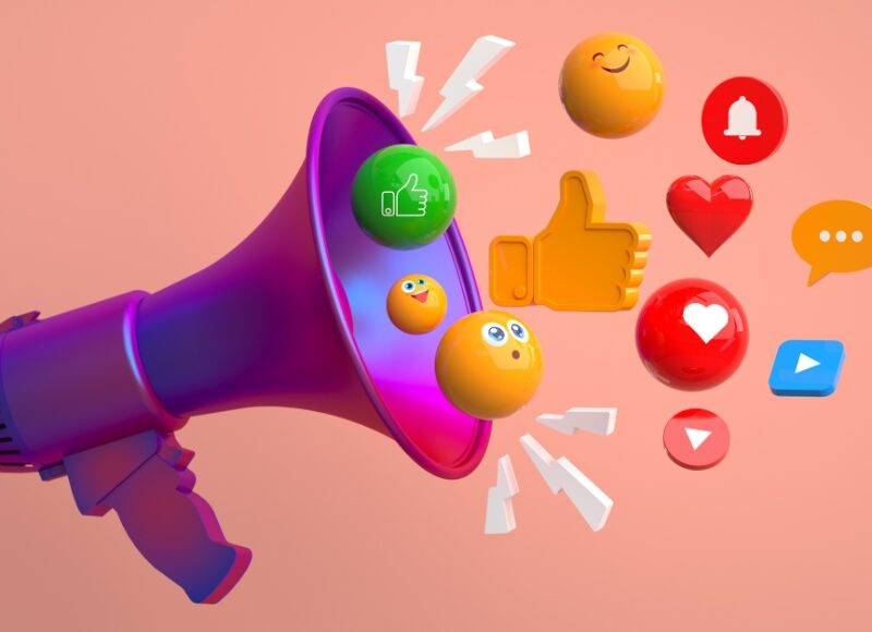 Small business and social media concept with a purple megaphone and floating social media icons on a pink background.
