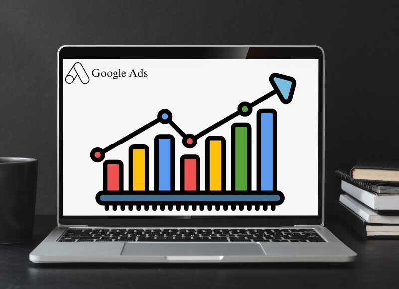 Laptop showing colourful performance chart with google ads northern beaches logo on black desk setup