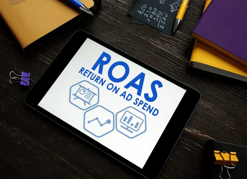 Google Ads Management Agency improving ROAS return on ad spend with data insights on tablet.
