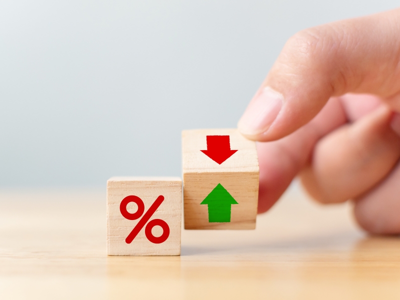 Wooden blocks showing percentage and arrows symbolising growth with google ads agency for small business.