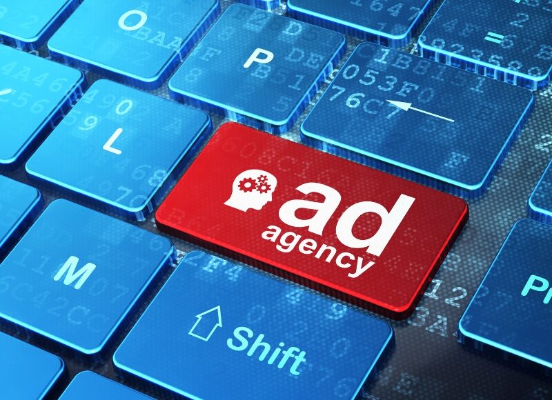 Google Ads Consultants represented by red ad agency button on computer keyboard.
