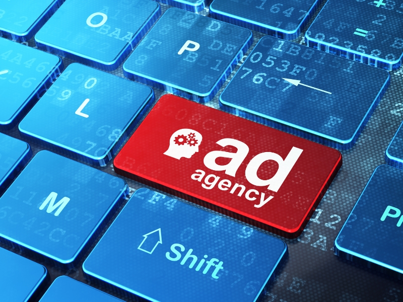 Google Ads Consultants represented by red ad agency button on computer keyboard.