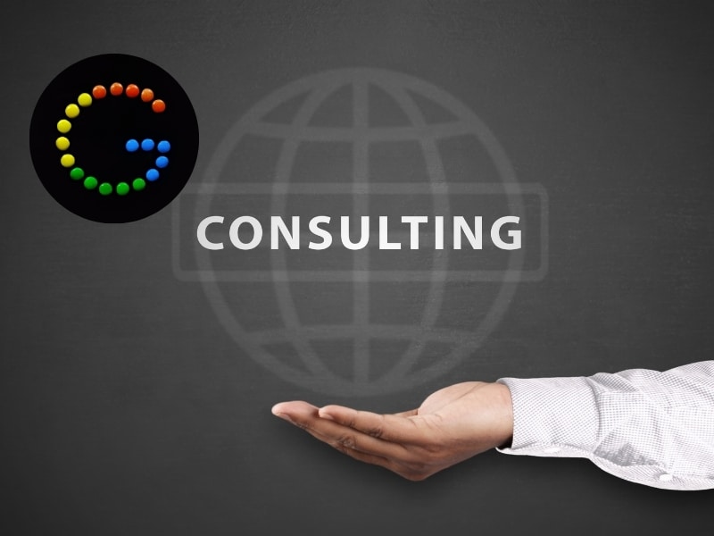 Hand presenting a digital consulting graphic with a colourful Google-style icon, representing google ads consulting services.