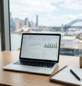 Laptop showing Google Ads performance metrics in a Sydney office setting.