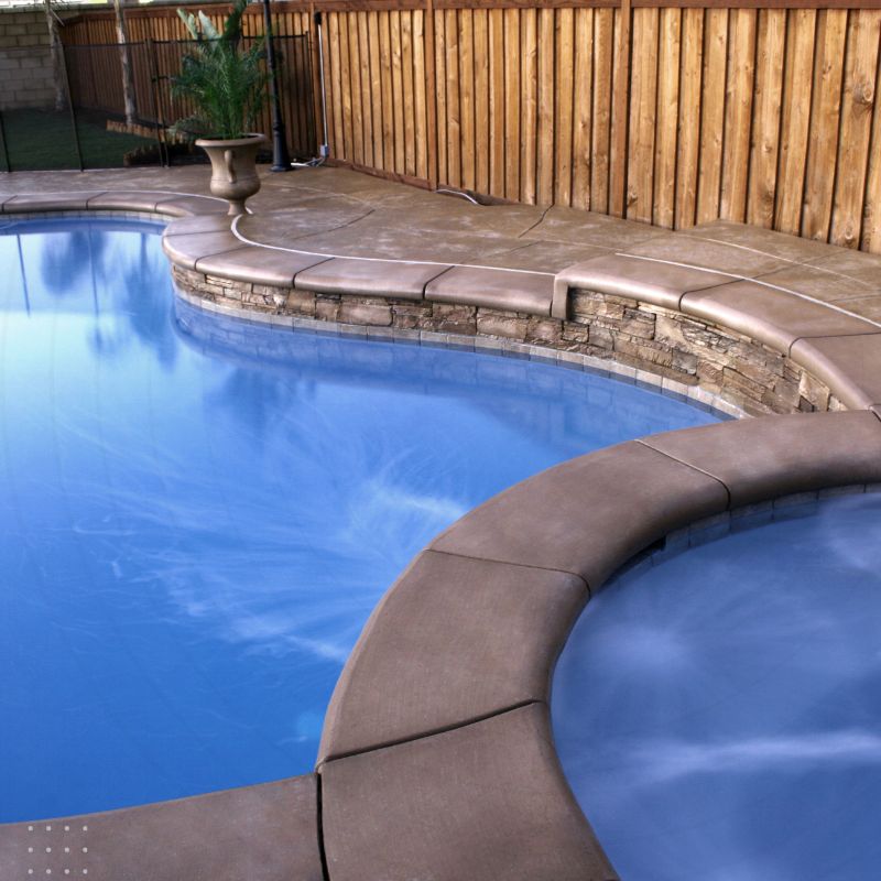 A stunning blue pool with clear water, surrounded by elegant brown bricks, representing the beauty and luxury of well-maintained pool and spa services from a trusted digital Marketing for Pools and Spas.